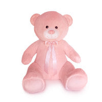 Pink teddy bear with a bow on a white background